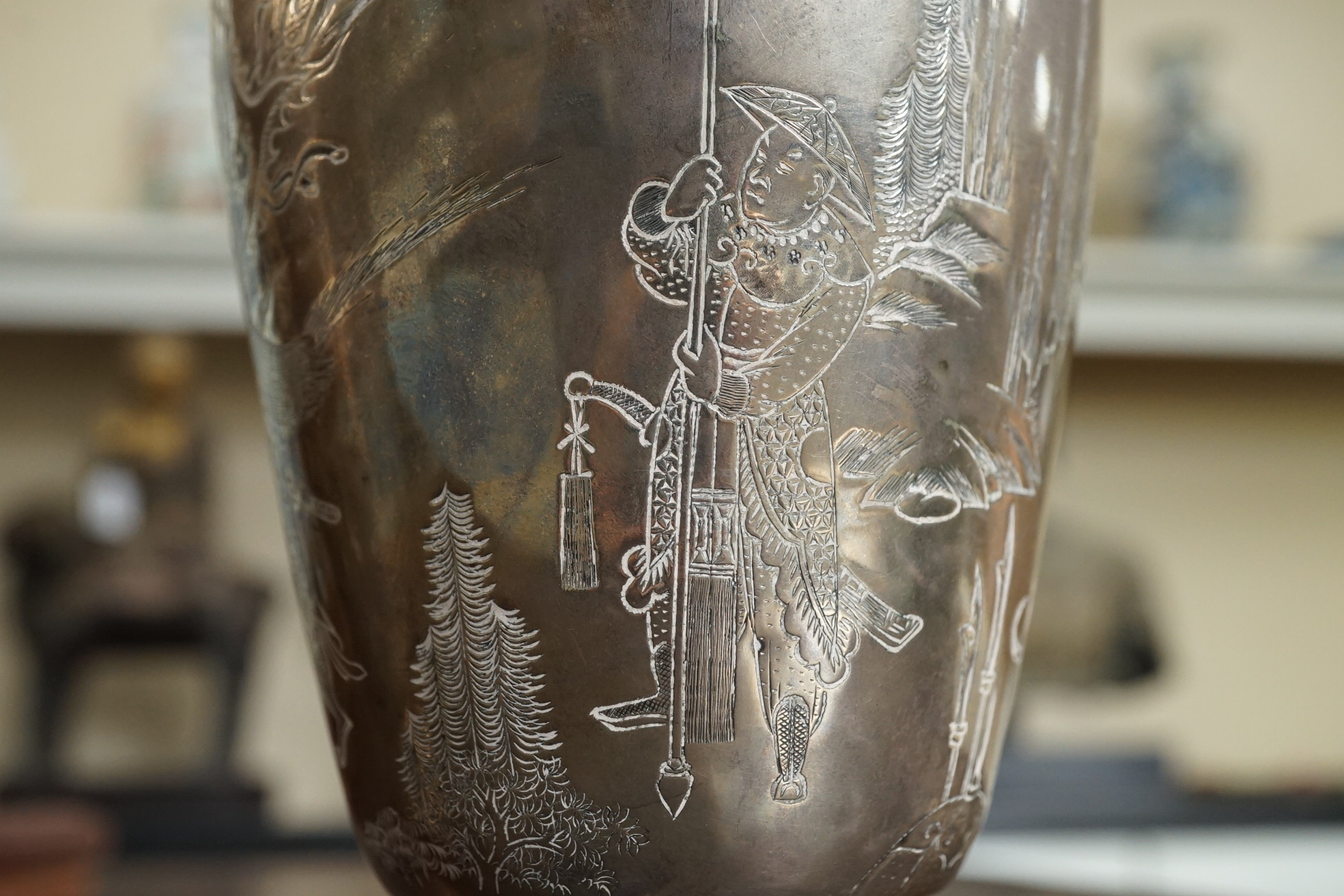 A pair of Chinese silver ‘immortals’ vases, late 19th century